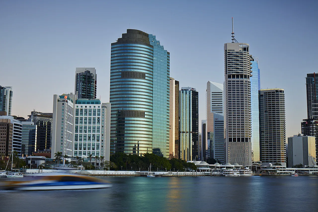 Waterfront Place, 1 Eagle Street — the curved glass tower seen across the Brisbane River